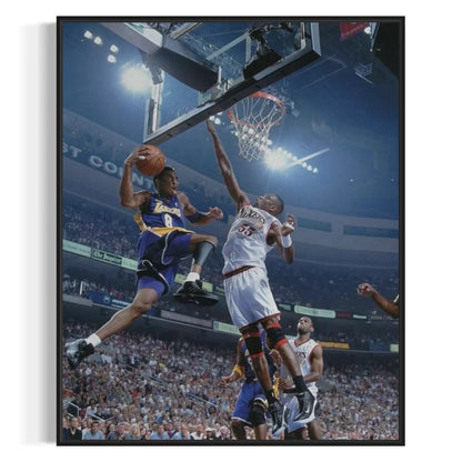 Framed wall art of Kobe Bryant soaring high during a Lakers vs 76ers game.