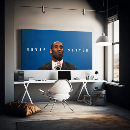 Kobe Bryant portrait featured prominently in the center against the blue background of the 'Kobe - Never Settle' poster.