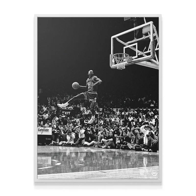 Wide-angle shot emphasizing the reflective court floor and spectators beneath the action captured in "Michael Jordan - Frozen In Time."