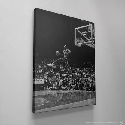 Angle showing the prominent backboard structure and rim detail above MJ in the classic "Michael Jordan - Frozen In Time" photograph.
