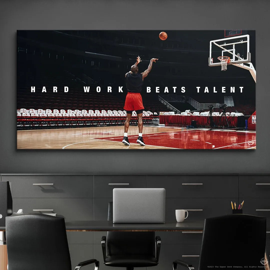 Lifestyle display showing the inspirational print Michael Jordan - Hard Work Beats Talent mounted in a modern home office setting.