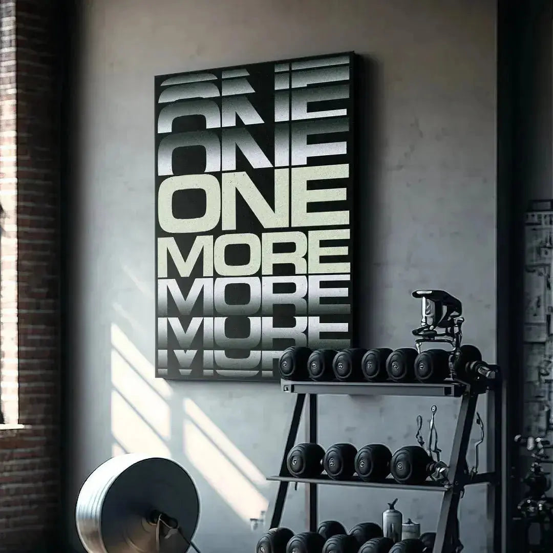 Lifestyle scene featuring the framed '1 More - 2' print hanging above a minimalist office desk.