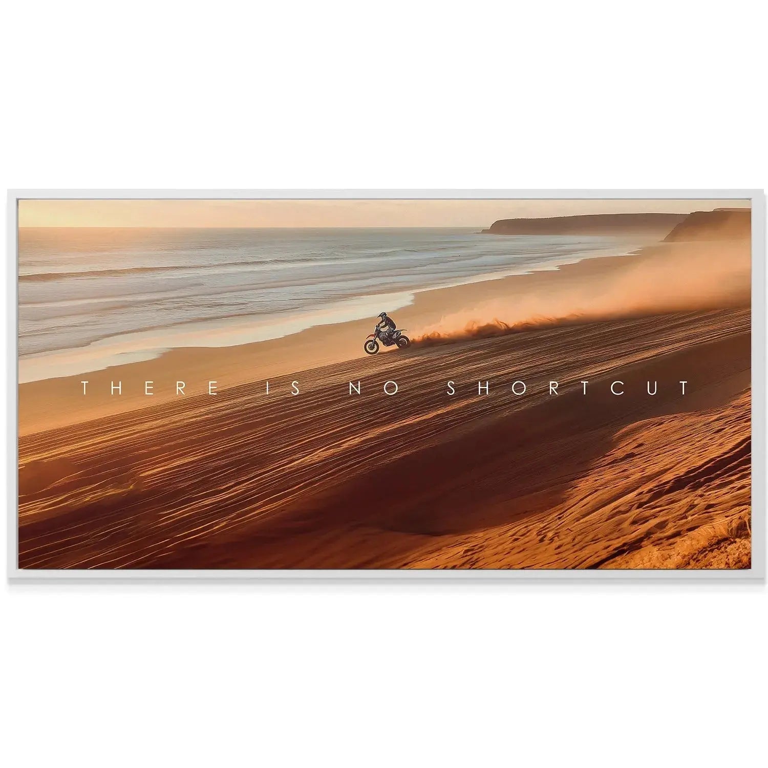 Textured surface shot focusing on the deep orange ripples of the desert dune below the quote, 'Action Sports - There Is No Shortcut'.