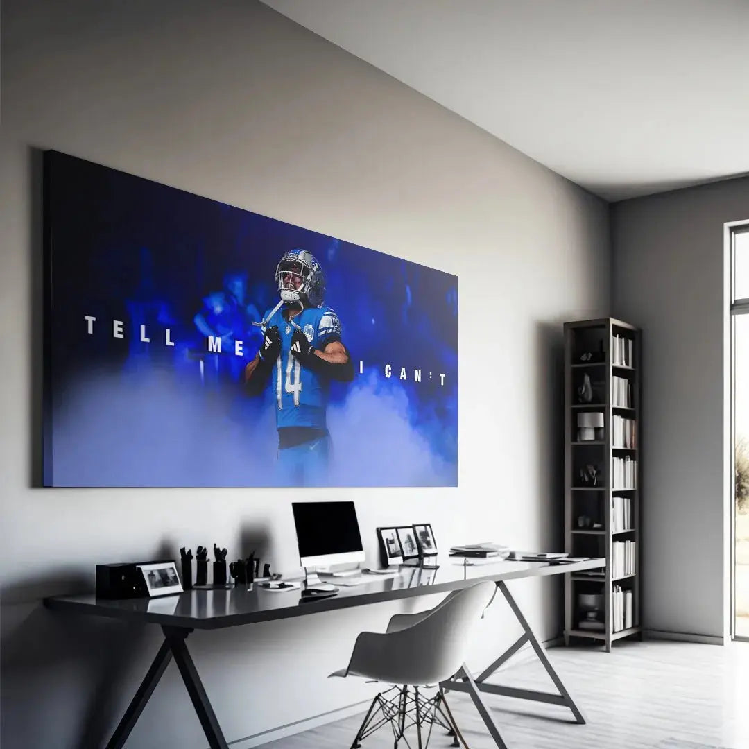 Lifestyle mock-up of the framed Amon Ra St. Brown - Tell Me I Can't artwork displayed in a contemporary fan cave.