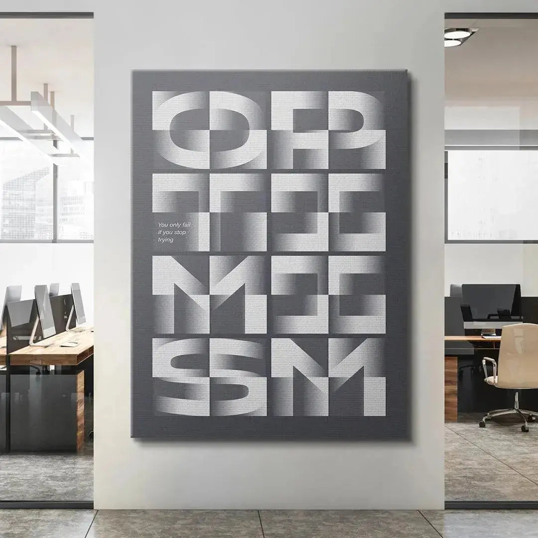 Lifestyle image of the poster placed above a modern desk setup to inspire employees to Be Optimistic.