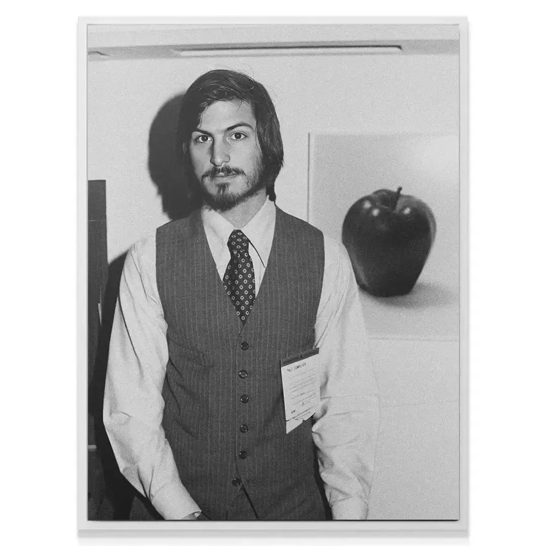 Black and white print showing the symbolic apple backdrop referencing the company's Beginnings.