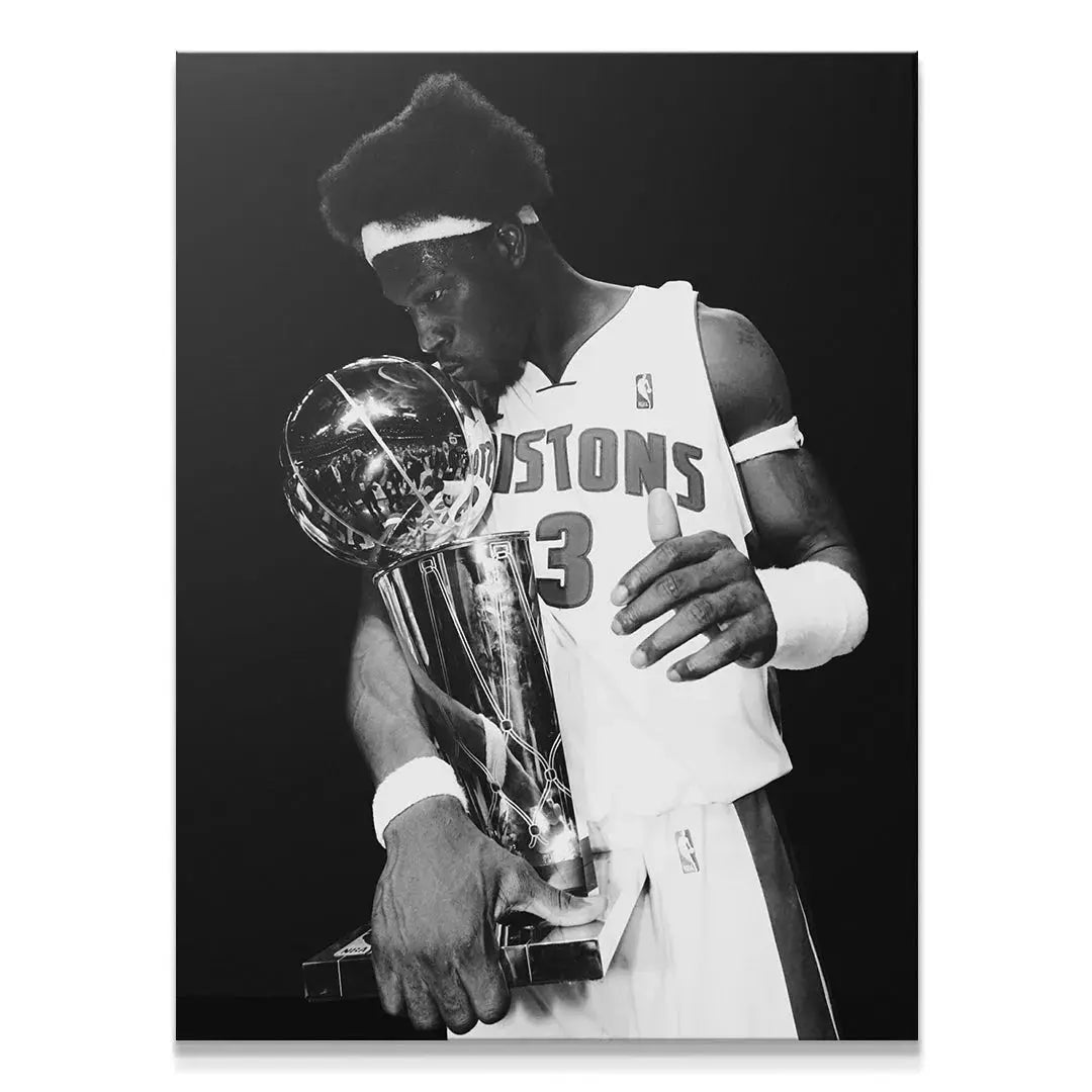 Close-up shot of Ben Wallace - #2 embracing the highly reflective championship trophy.