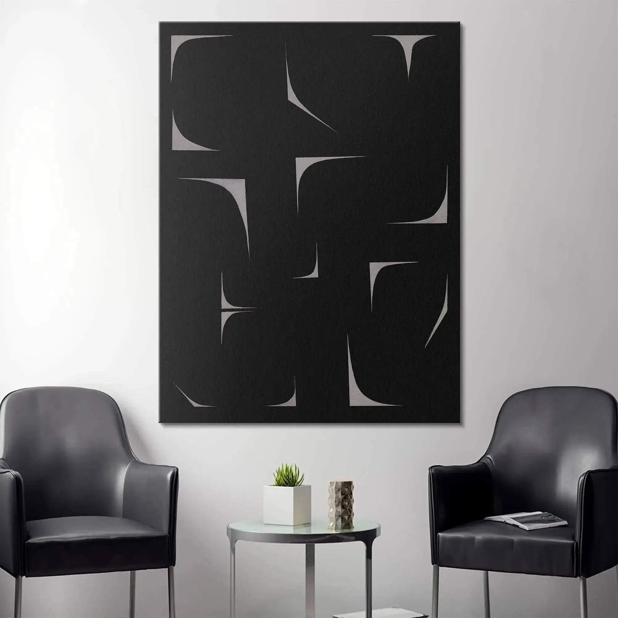 Lifestyle shot of the modern Black Agalma hanging above a contemporary sofa.