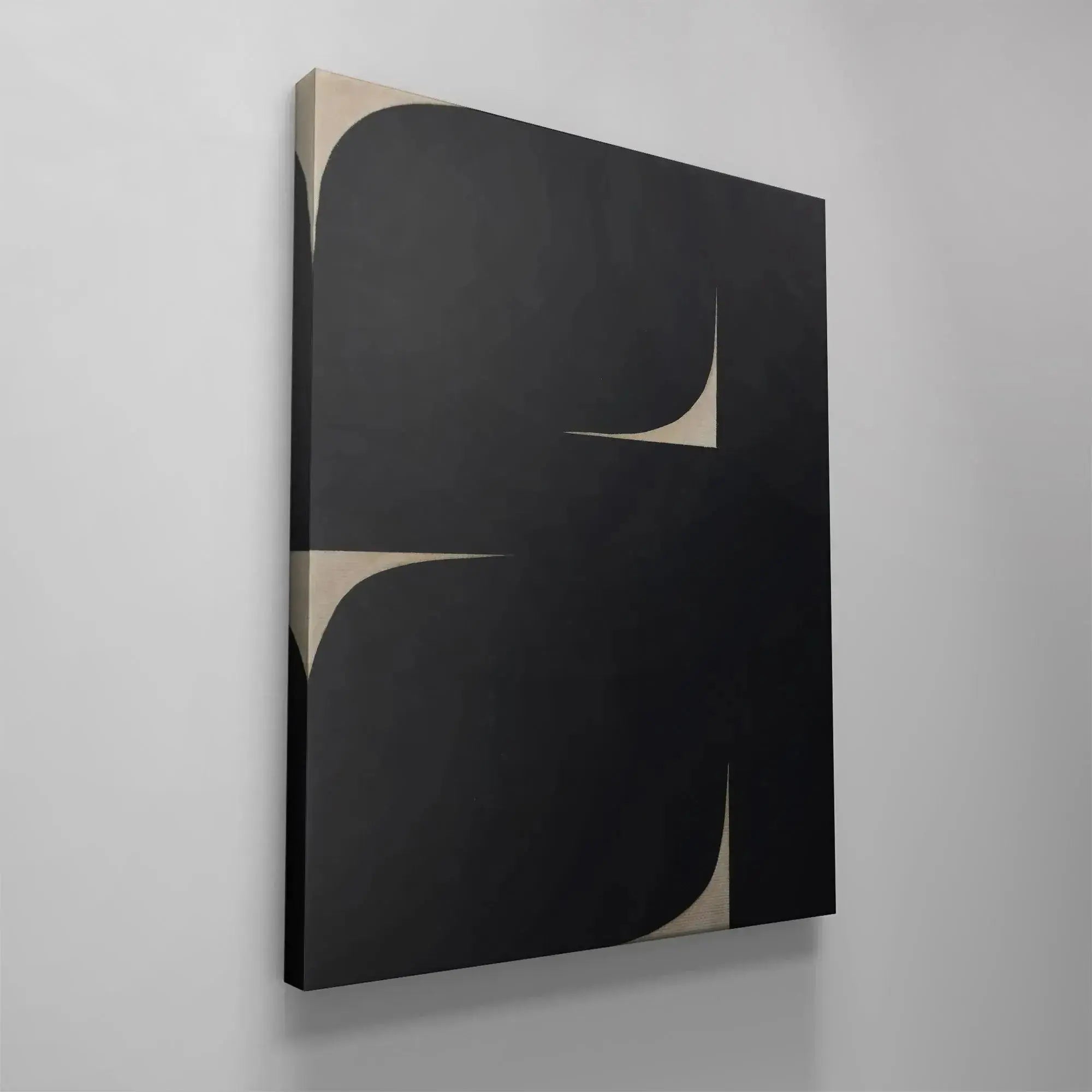 The subtle beige background revealed by the sharp curved cutouts in Black Soh