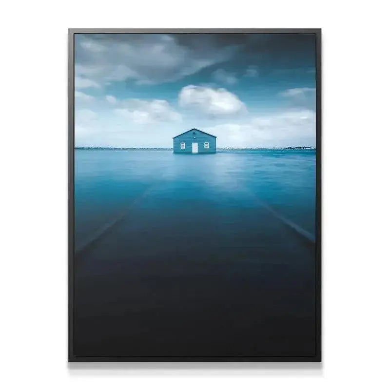 Close-up detail of the texture of the wooden Blue Boat House facade against the cloudy sky.