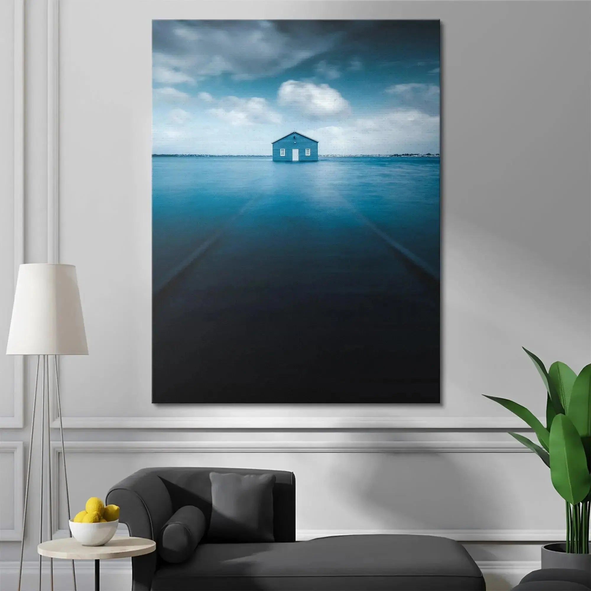 Vertical perspective of the deep blue water leading towards the symmetrical Blue Boat House.