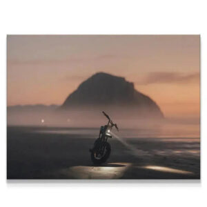 Close-up of the motorcycle headlight beam piercing the mist on the beach, titled Blue Hour Morro.