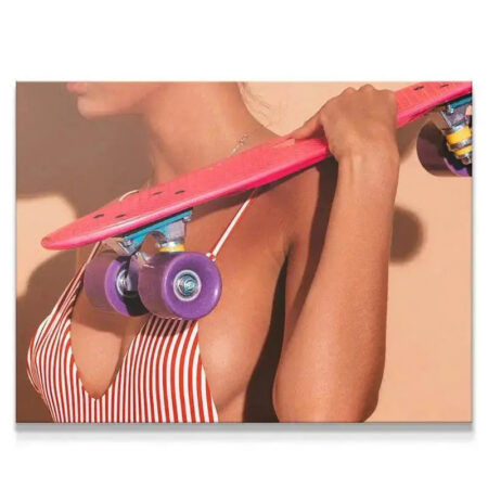 Close-up view of the pink skateboard deck and purple wheels illustrating the 'Board Summer' mood.