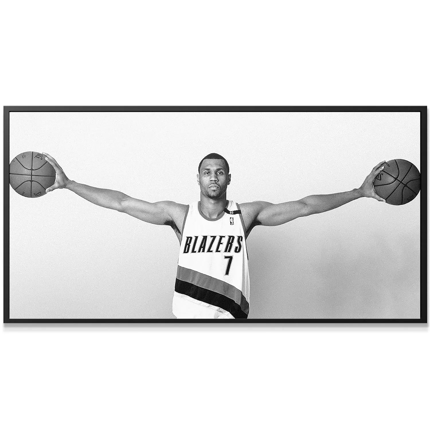 Monochrome portrait highlighting the perfect symmetry of Brandon Roy - Arms and dual basketballs.