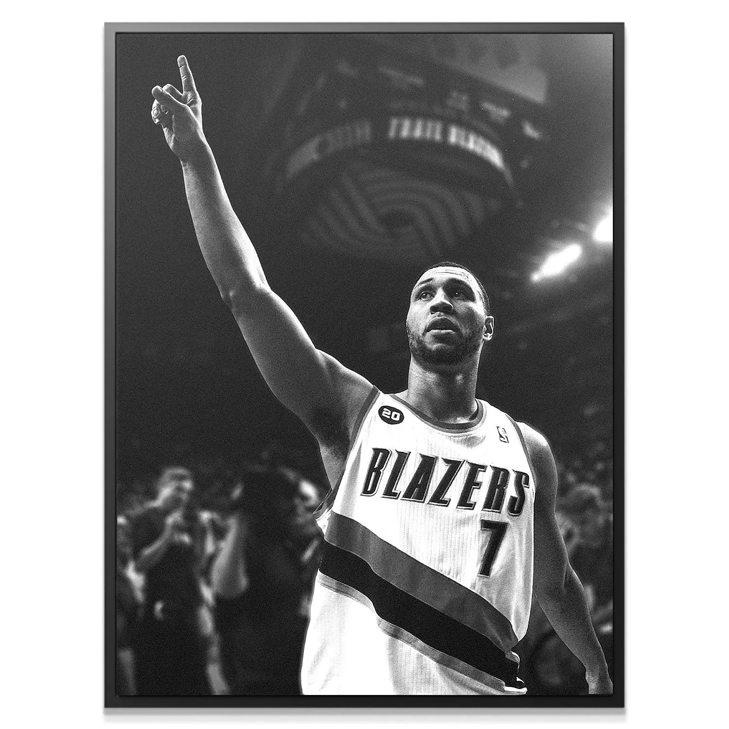 Close-up profile of Brandon Roy - Point focused and pointing upward after scoring in the arena.