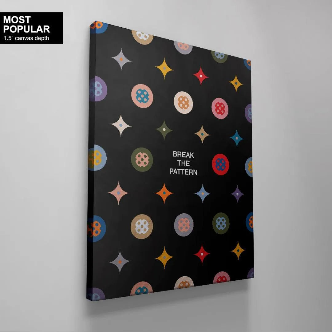 The artistic repeating pattern of four-pointed stars and circular icons on the matte finish of the Break the Pattern Black Edition.