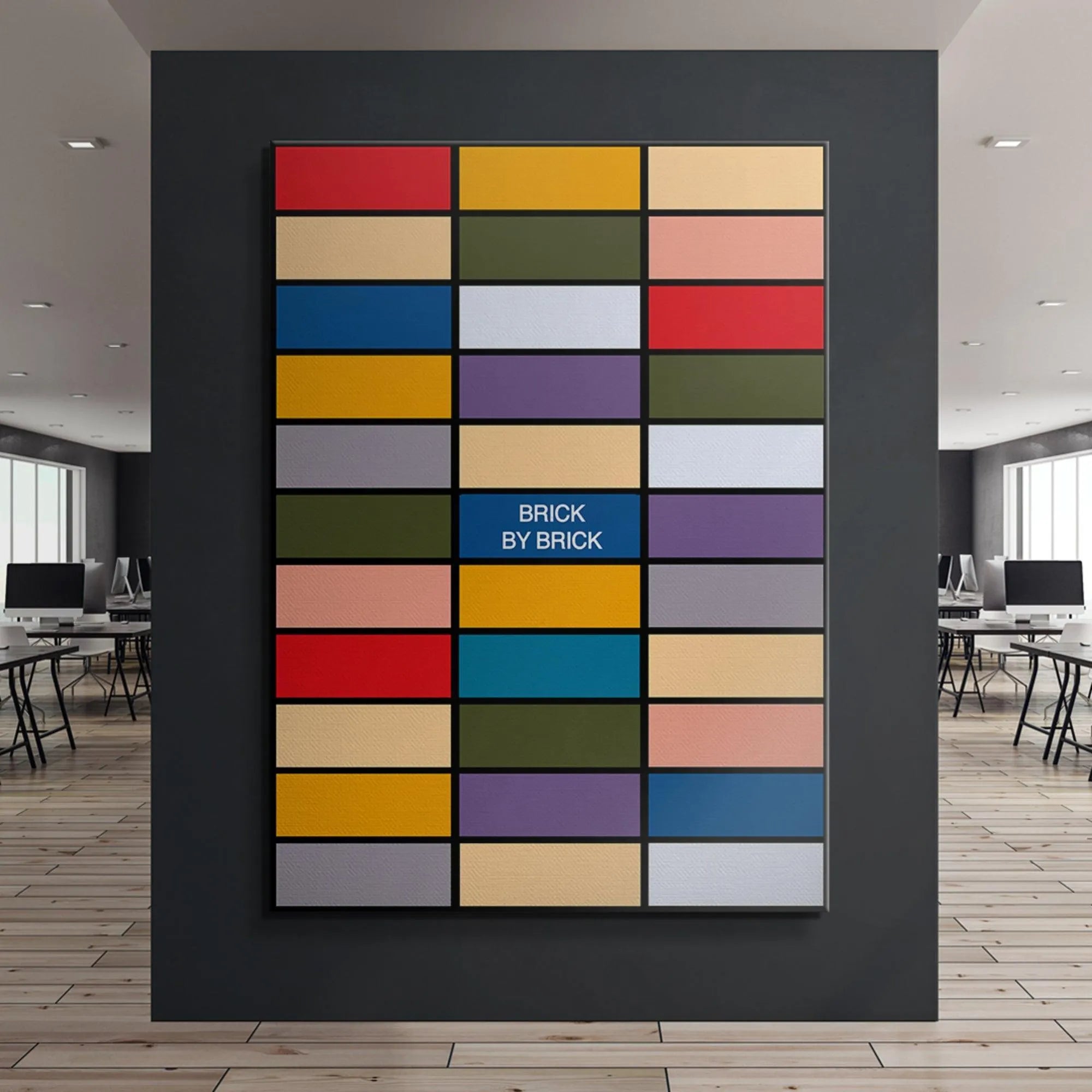 Angled shot of the framed 'Brick by Brick' artwork hanging in a minimalist living room setting.