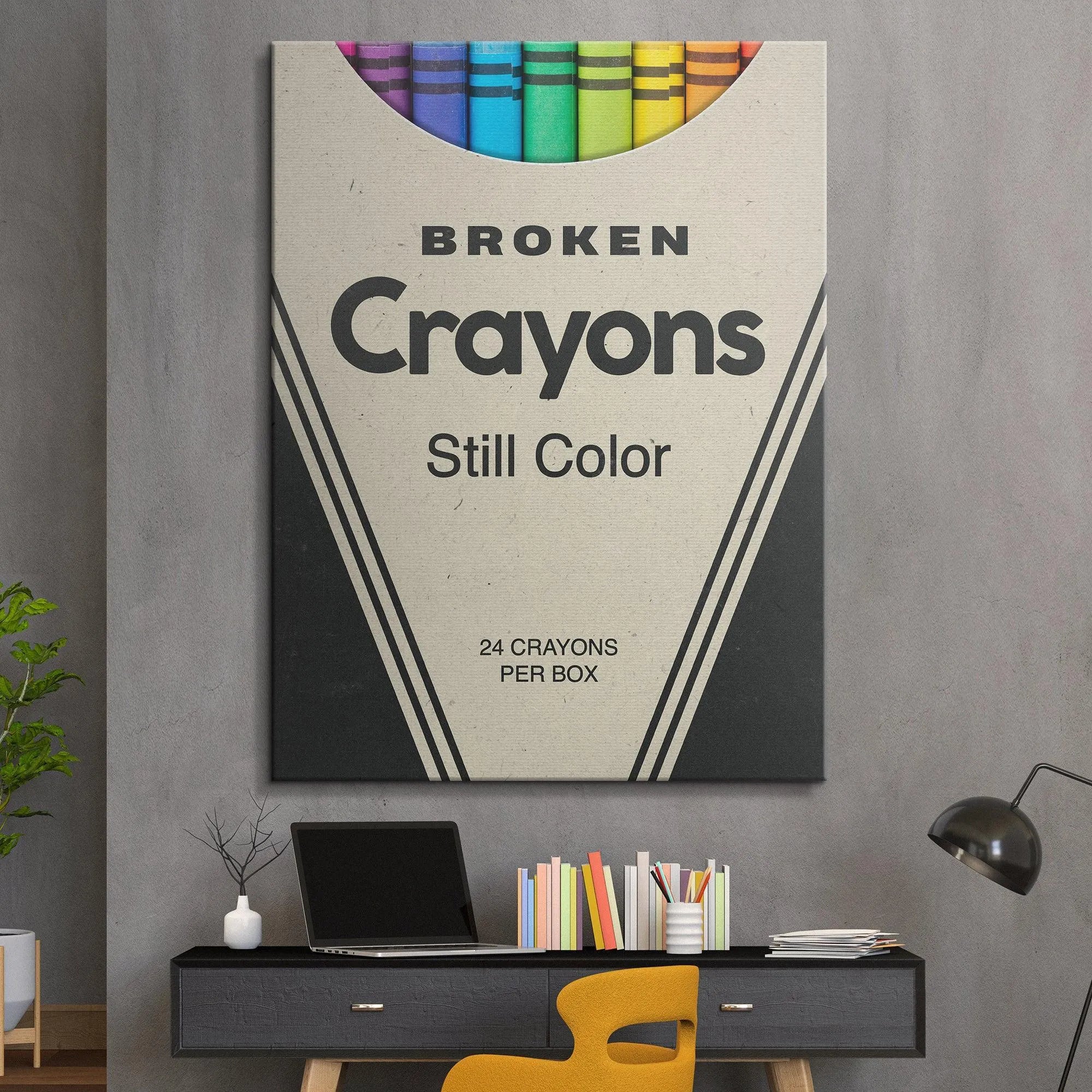 Angled shot highlighting the striped paper wrappers of the various colored Broken Crayons inside the container.