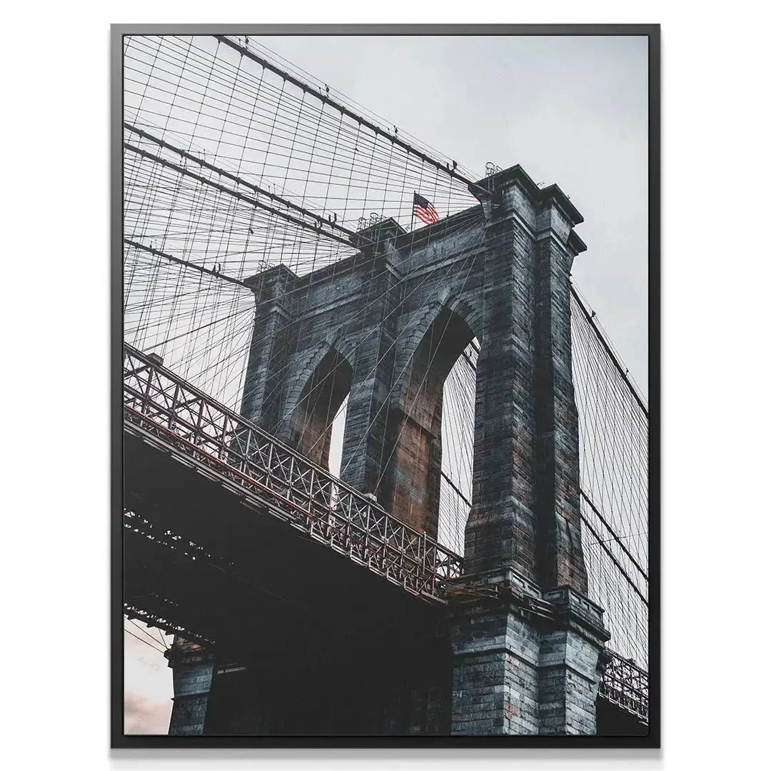 Close-up texture shot of the rugged granite masonry on the Brooklyn Bridge tower.