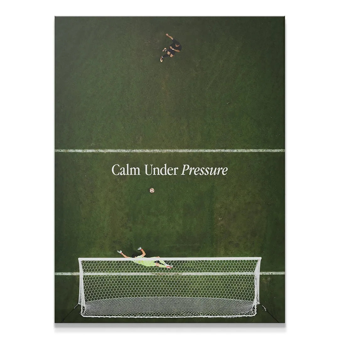 Stunning aerial view of the diving goalie during a critical play, illustrating 'Calm Under Pressure (Soccer)'.