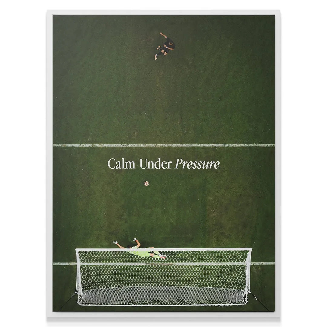 Wide angle lifestyle shot of the framed 'Calm Under Pressure (Soccer)' canvas mounted on a modern wall.