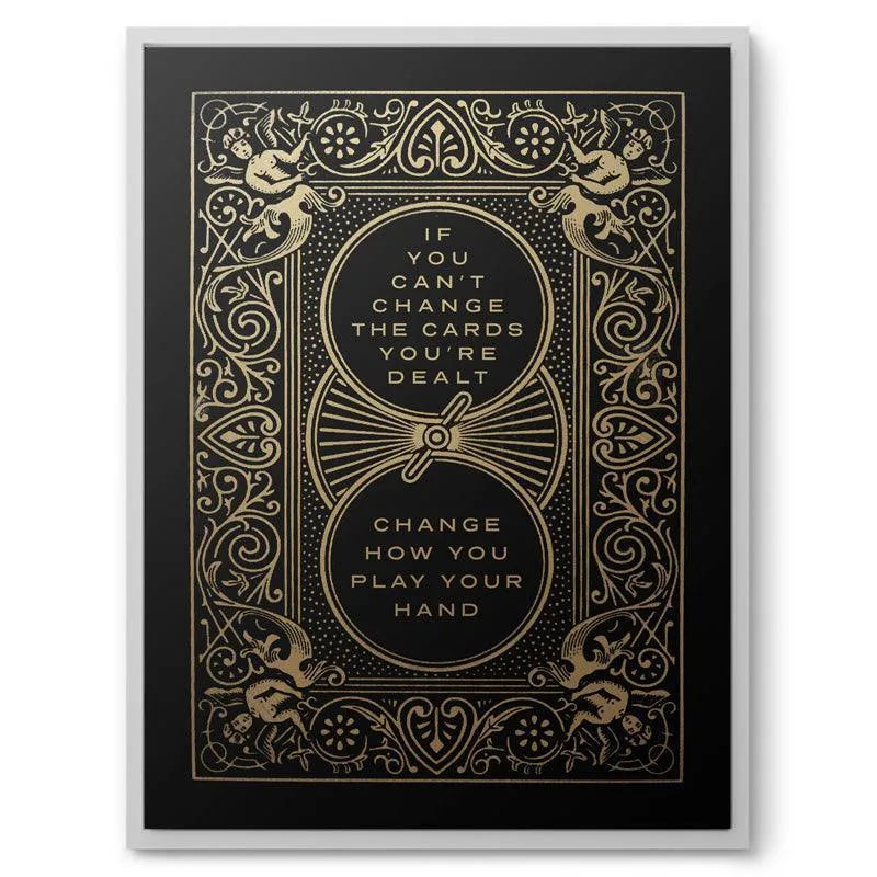 Angled shot highlighting the reflective gleam of the metallic gold stamping on the cover of 'Cards You’re Dealt'.