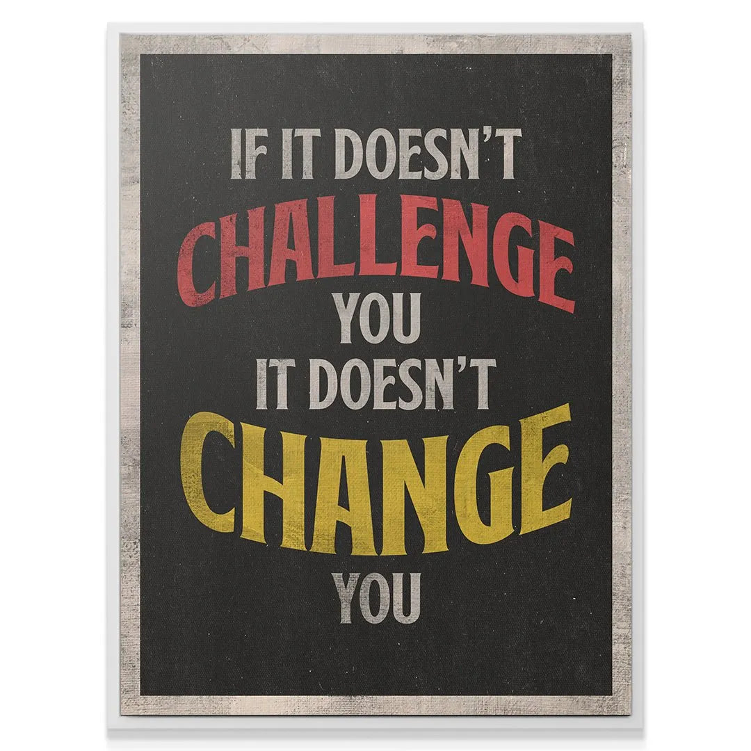 Angled shot of the 'Challenge & Change' wall art mounted in an office setting above a contemporary wooden desk.