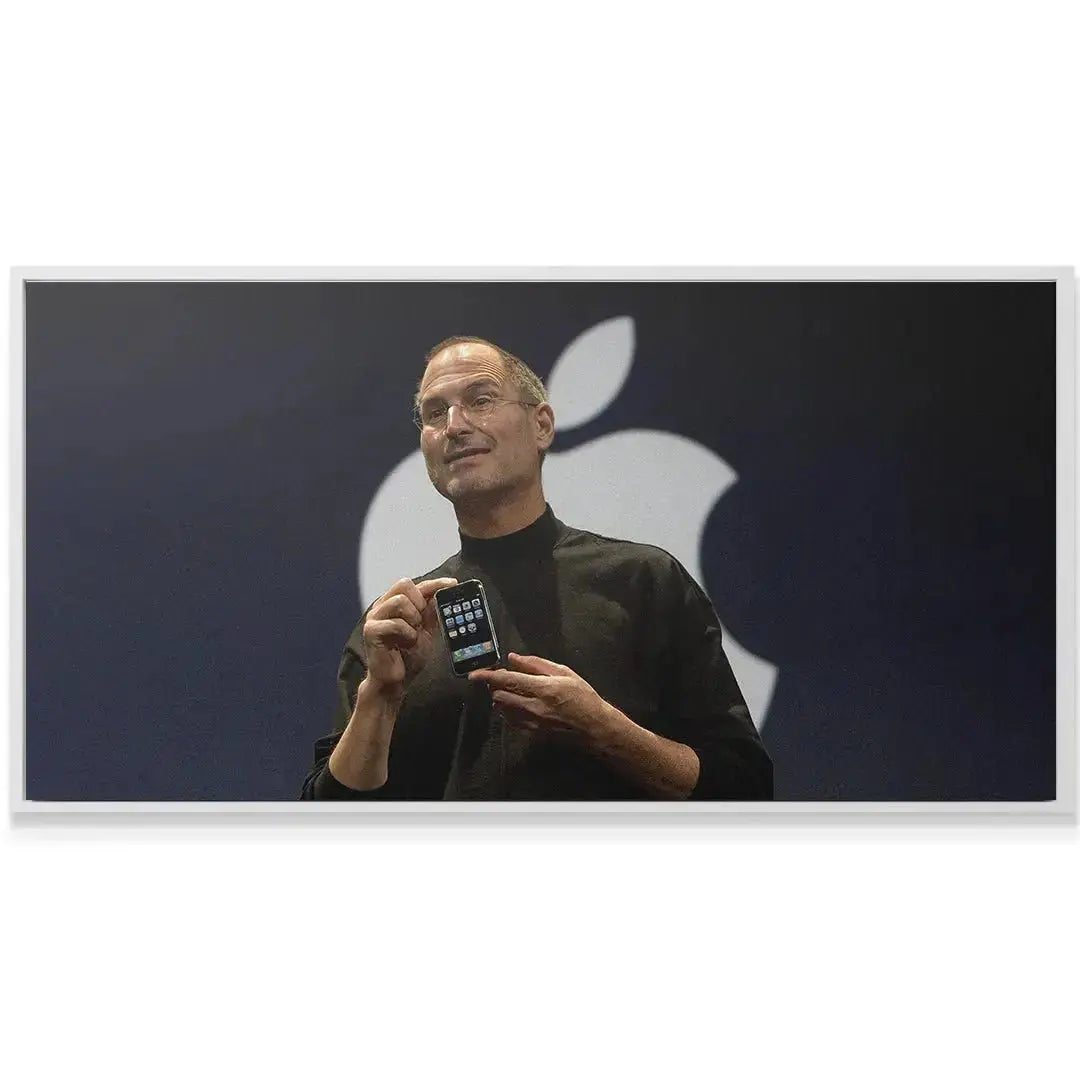 Detailed view of the phone screen interface held by Jobs, contrasting with the backdrop quote to Change the World.