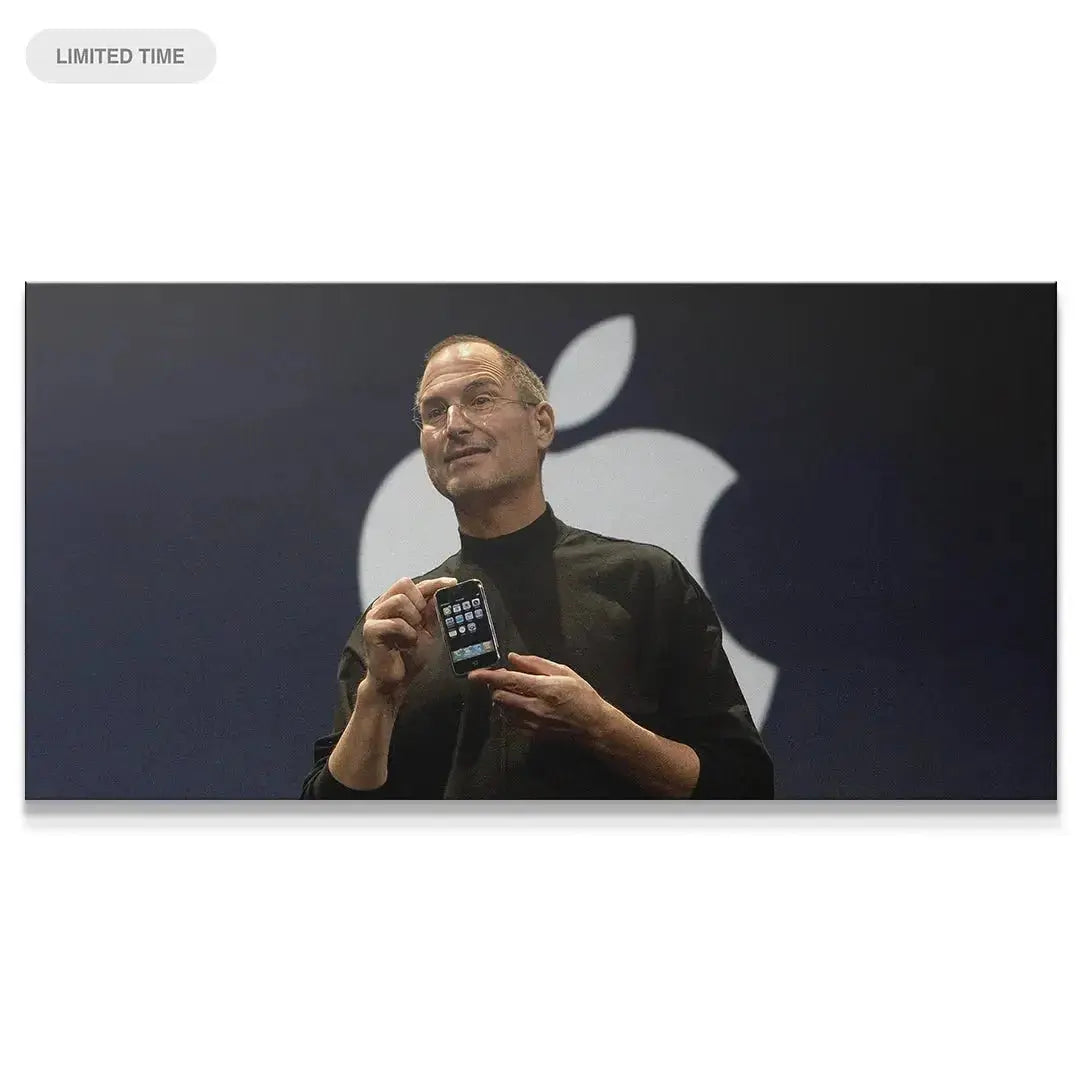 Standard close-up of Steve Jobs holding the original iPhone on stage, embodying Change the World (No Quote).