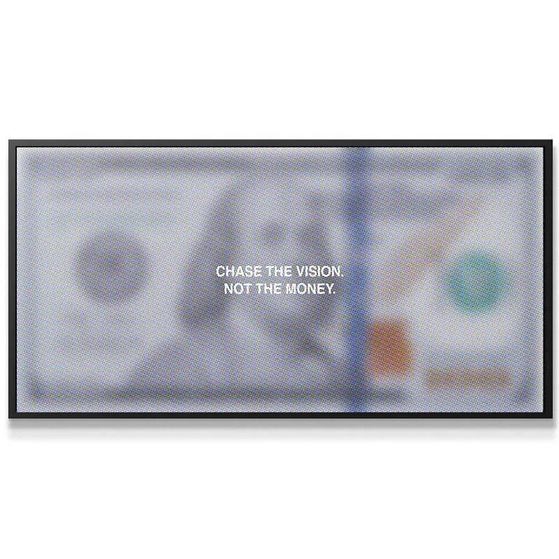 Horizontal view of the bold, quoted 'Chase The Vision' artwork in a sophisticated office setting.