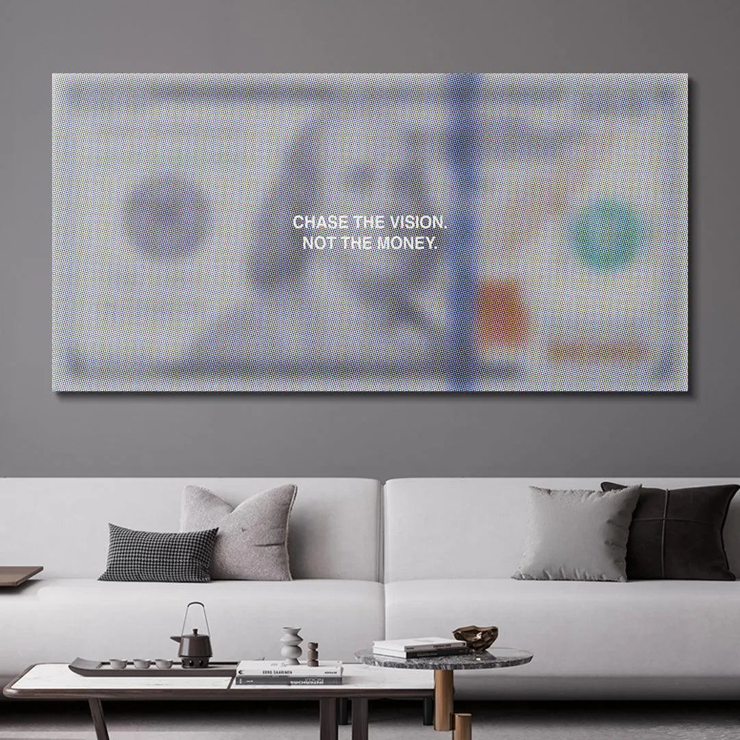 Lifestyle display of the inspiring 'Chase The Vision' print hanging above a minimalist desk setup.