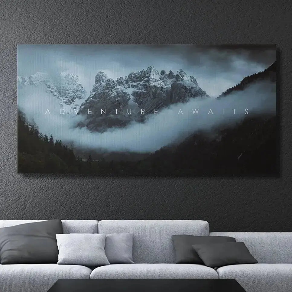 Inspirational wall art showing the white text overlay against the high-contrast dark peaks: 'Chris Henry - Adventure Awaits'.
