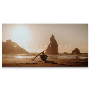 Chris Henry – Mentally Here Wall Art Wide view of surfer silhouette and towering sea stacks at golden hour in 'Chris Henry - Mentally Here' art print.