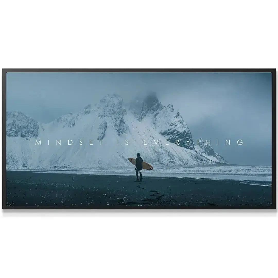 Wide-angle view of snow-capped mountains towering over the black sand beach art, 'Chris Henry - Mindset Is Everything'.
