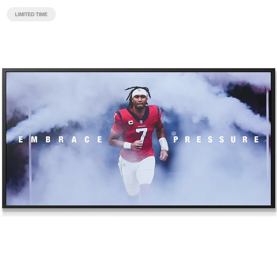 Close-up detail of CJ Stroud's determined expression and jersey number 7 on the Embrace Pressure artwork.