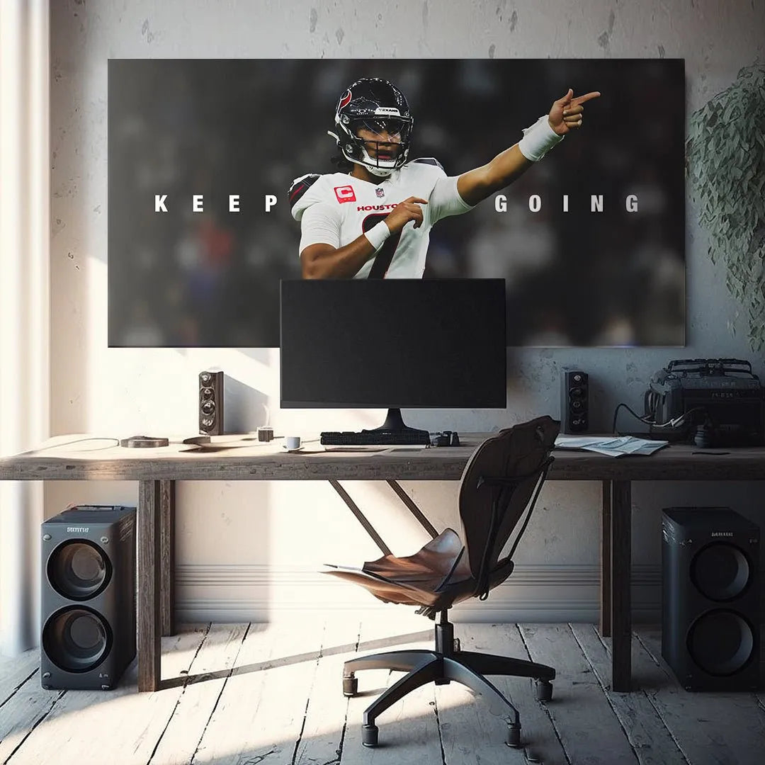 Lifestyle image of the large-format "CJ Stroud - Keep Going" artwork mounted over a modern living room sofa.
