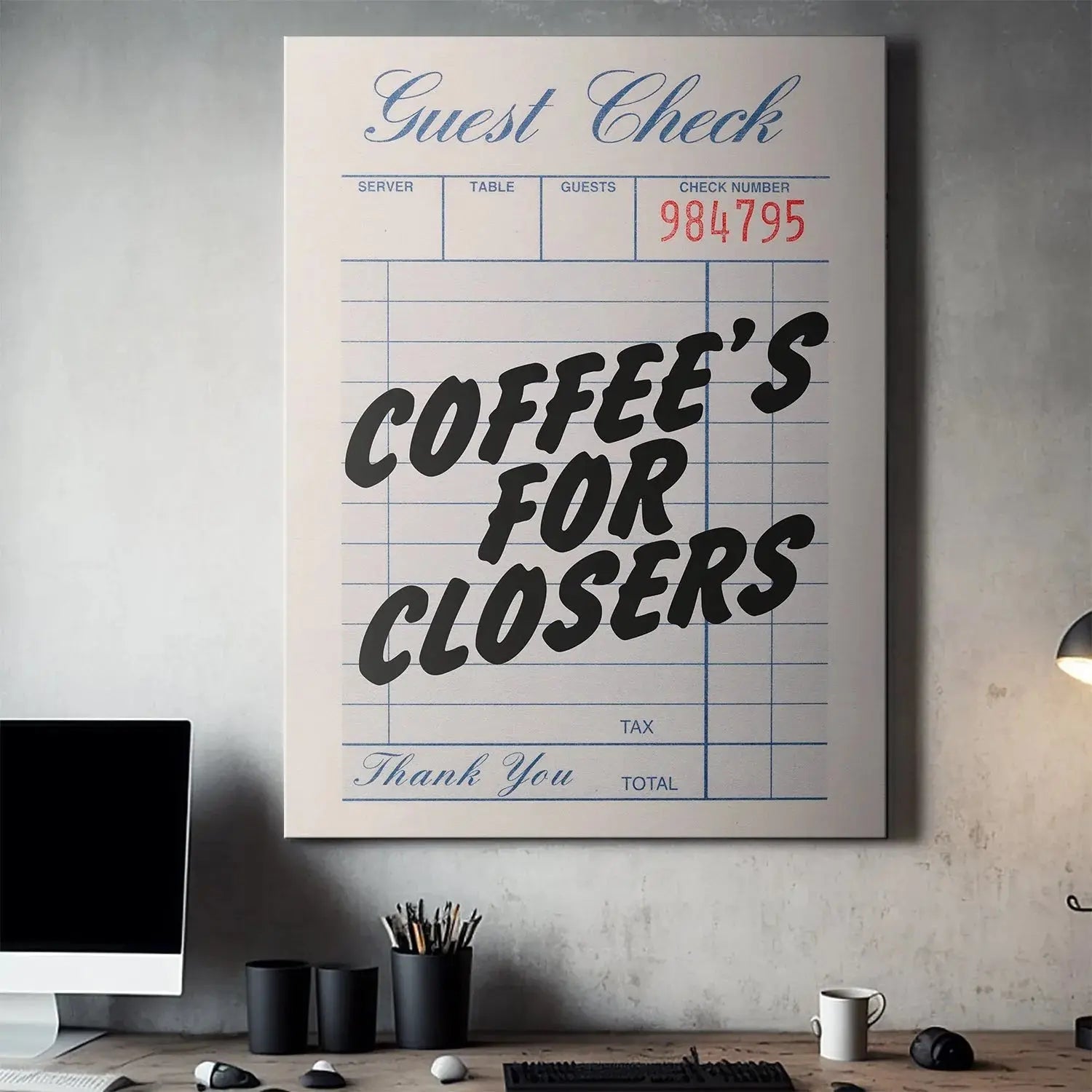 Angled lifestyle photo of the 'Coffee's For Closers - Check' next to a fresh coffee mug and sales ledger.