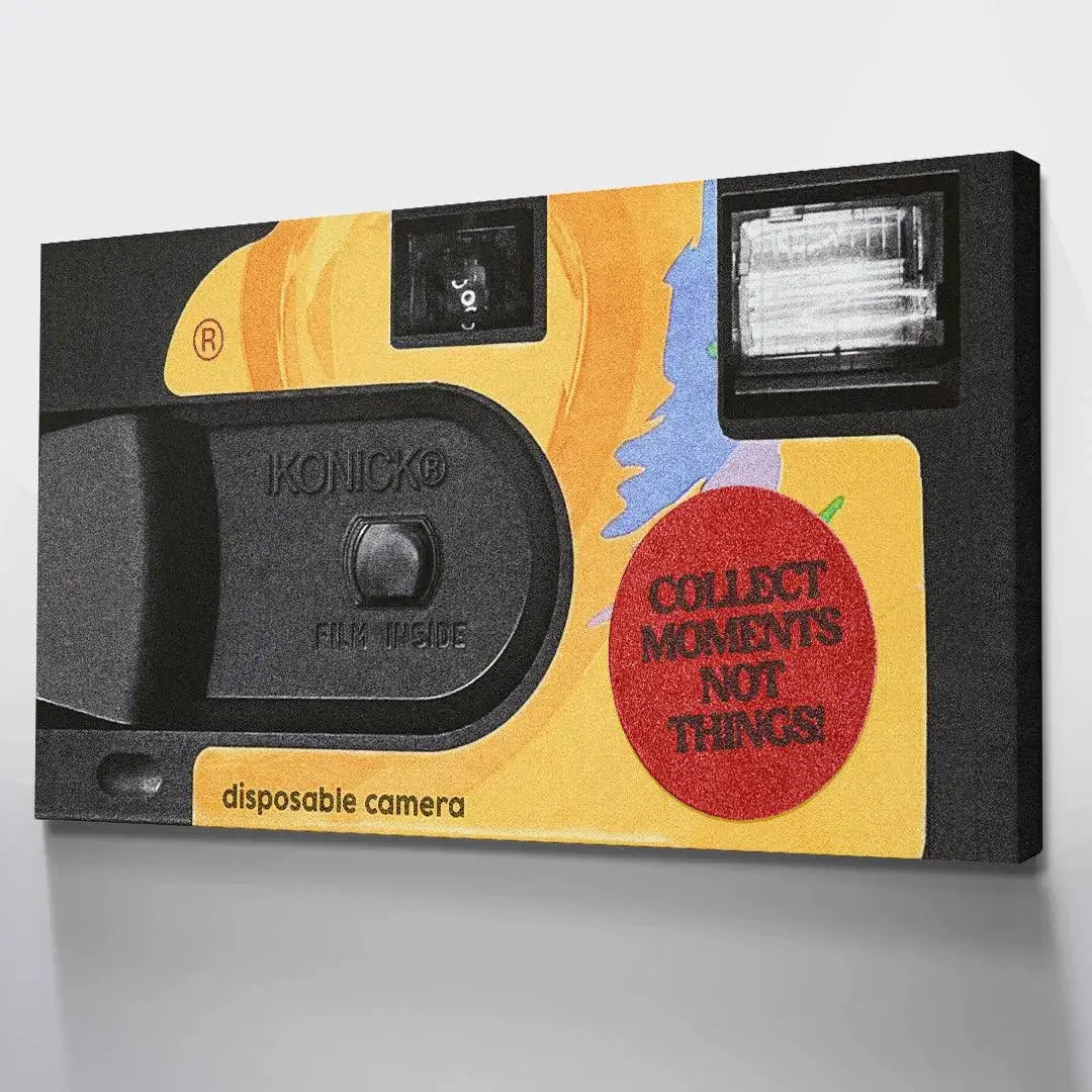 Macro shot focusing specifically on the red circular sticker proclaiming "Collect Moments Not Things!" on the camera packaging.