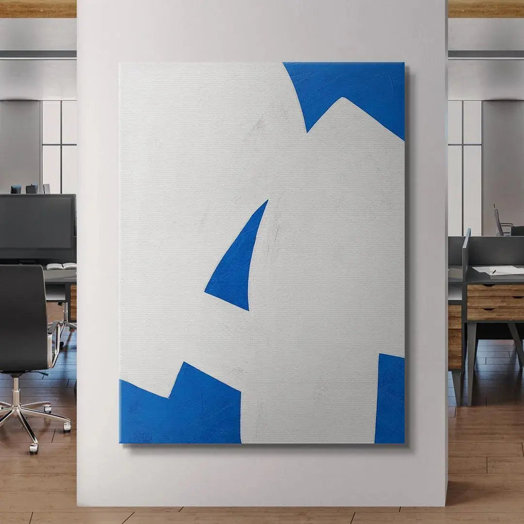 Colliding Shapes Blue N.2 displayed above a modern gray sofa in a minimalist living room setting.