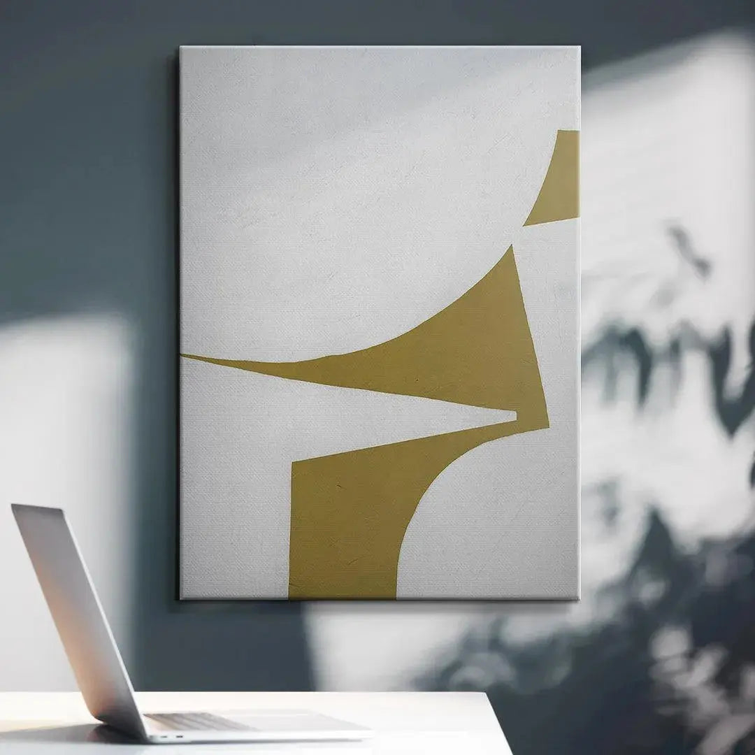 The sharp, pointed elements of Colliding Shapes Gold N.3 where the olive-gold shape meets the white border.