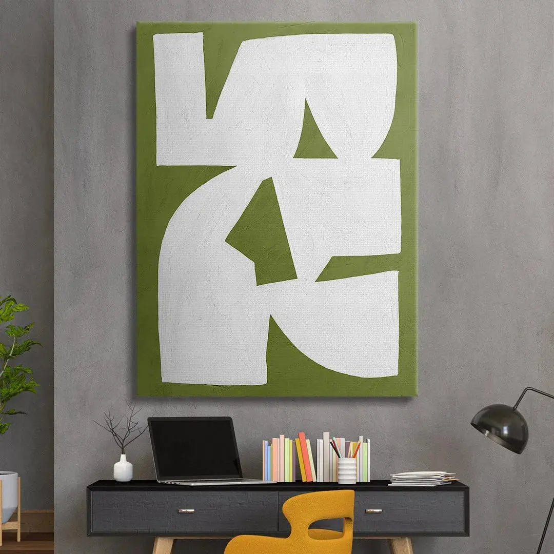 Colliding Shapes Green N.1 hanging above a minimalist sofa, providing a modern lifestyle decor context.