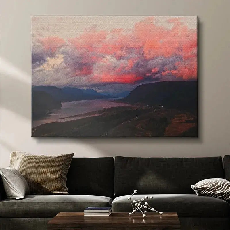 Dark mountain silhouettes framing the horizon beneath the intense light of the Cotton Candy Clouds.