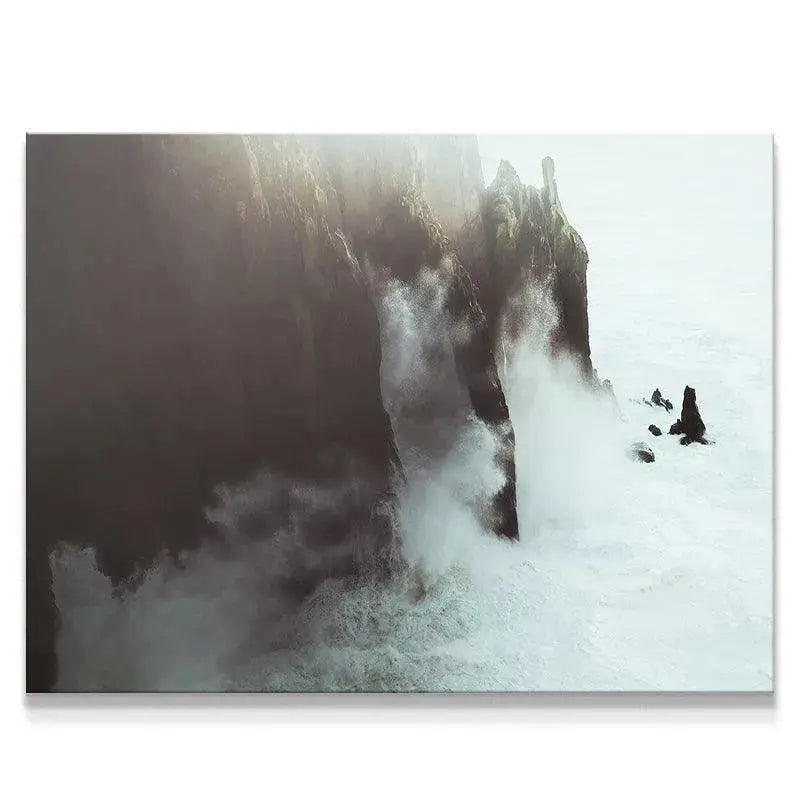 Atmospheric shot of high cliffs with turbulent white water, emphasizing Crashing Waves.