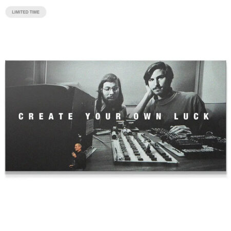 Black and white motivational canvas art close-up, highlighting the phrase 'Create Your Own Luck' in bold white lettering.