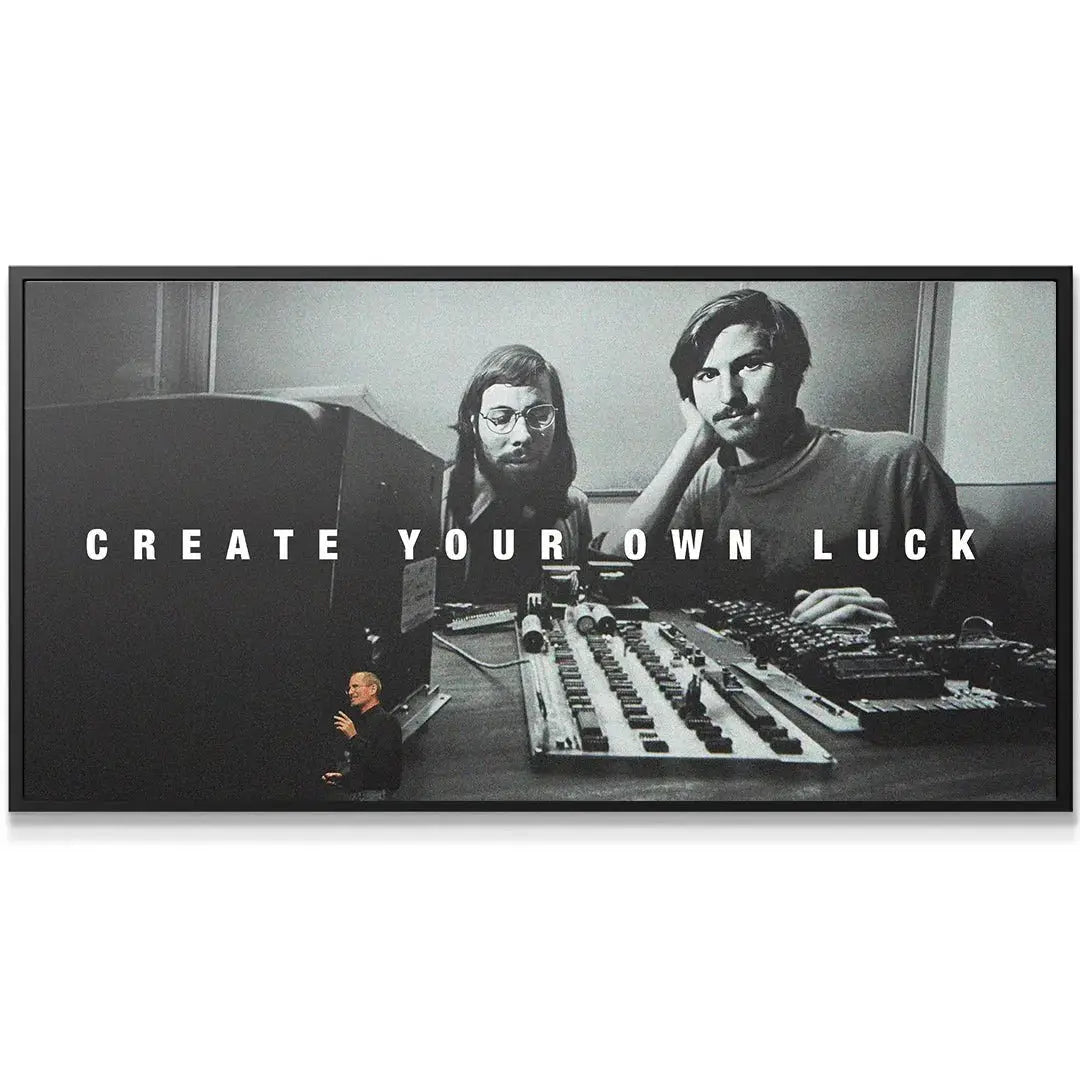 Full wide view of the historic photograph featuring two tech founders surrounded by hardware: Create Your Own Luck.