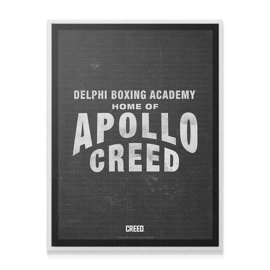 Corner perspective showing the thick black frame surrounding the high-contrast 'Creed - Apollo Creed' movie poster.