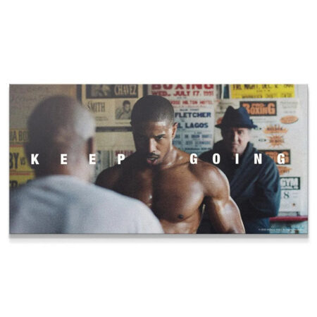 Cinematic wide shot of Adonis Creed training, centered on the motivational phrase Creed - Keep Going.