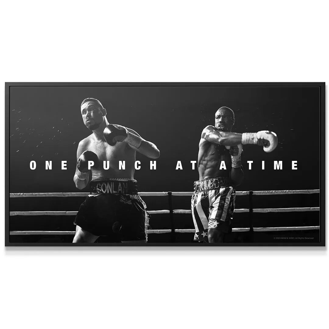Black and white action photography showing sweat flying during the intense pivotal boxing scene: Creed - One Punch At A Time.
