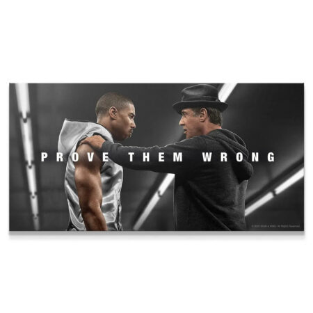 Wide shot of Adonis and Rocky exchanging intense glances in the "Creed - Prove Them Wrong" poster.