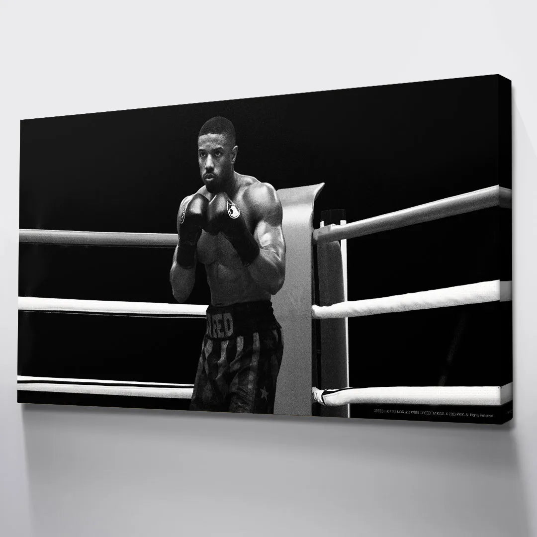 Boxing gloves detail and defensive stance captured dramatically for 'Creed - Round 1'.